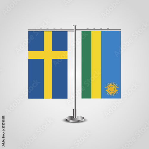 Table stand with flags of Sweden and Rwanda.Two flag. Flag pole. Symbolizing the cooperation between the two countries. Table flags