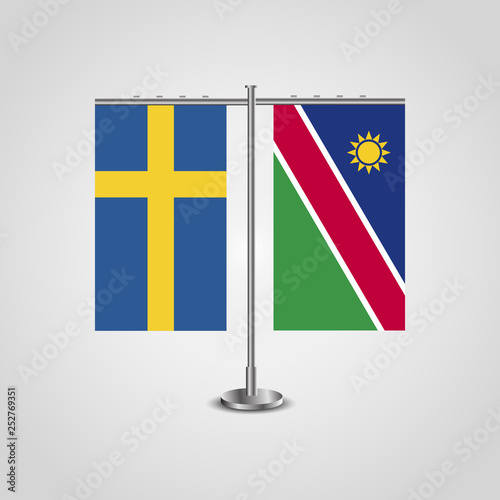 Table stand with flags of Sweden and Namibia.Two flag. Flag pole. Symbolizing the cooperation between the two countries. Table flags