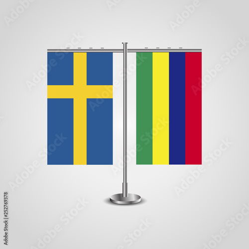 Table stand with flags of Sweden and Mauritius.Two flag. Flag pole. Symbolizing the cooperation between the two countries. Table flags
