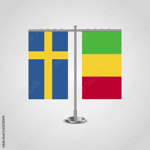Table stand with flags of Sweden and Mali.Two flag. Flag pole. Symbolizing the cooperation between the two countries. Table flags