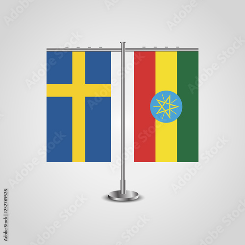 Table stand with flags of Sweden and Ethiopia.Two flag. Flag pole. Symbolizing the cooperation between the two countries. Table flags