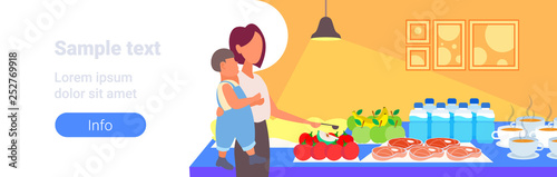 mother with little son tourists choosing dishes from table catering and tourism concept hotel restaurant interior portrait horizontal copy space