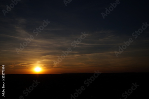 Sunset silhouette of church cross at sunset