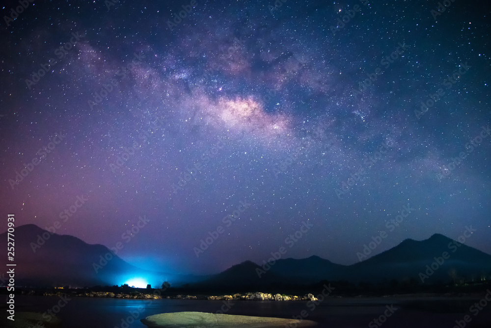 Milky Way galaxy landscape rivers and light with mountains background in the  dark night sky