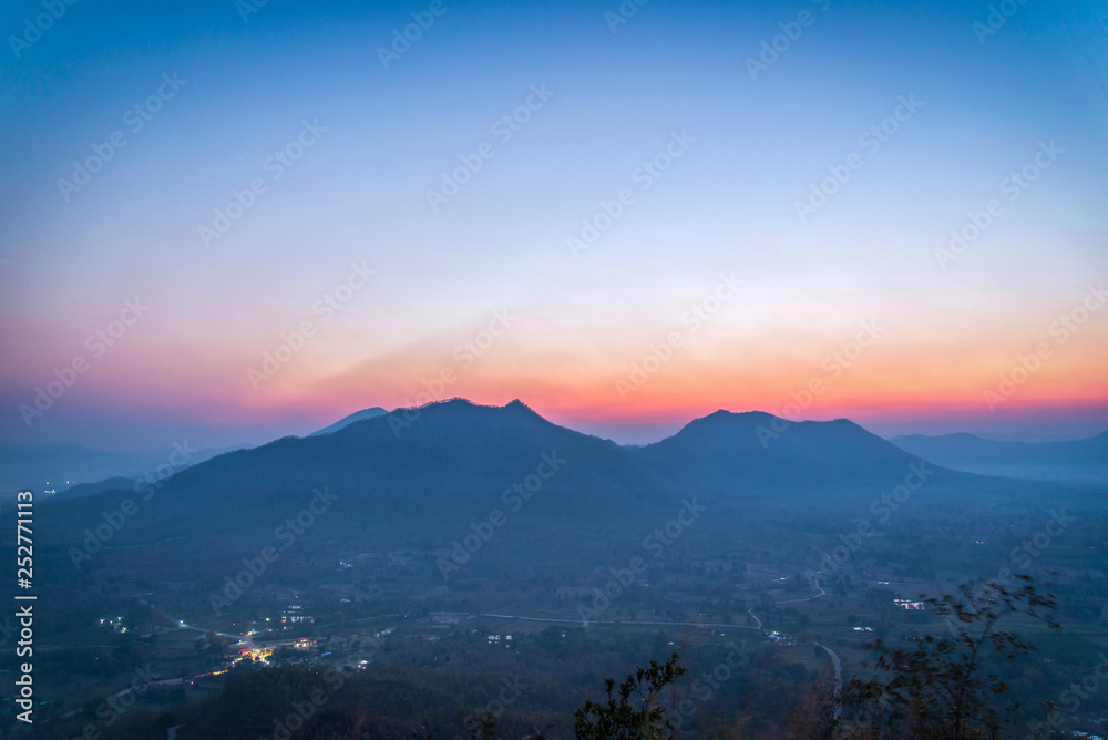 Sunrise landscape mountain scene in the morning village background