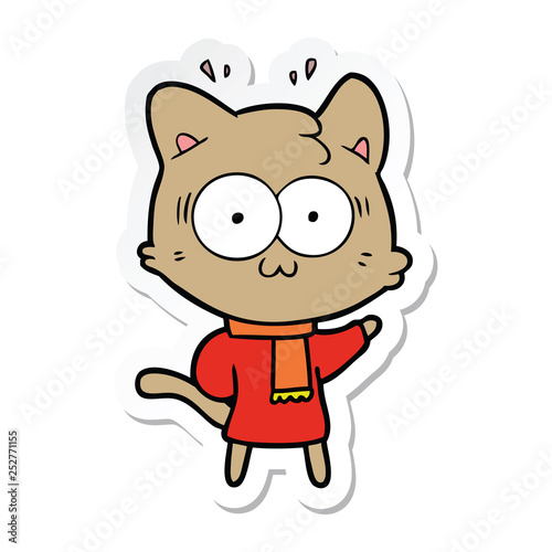 sticker of a cartoon surprised cat wearing warm winter clothes