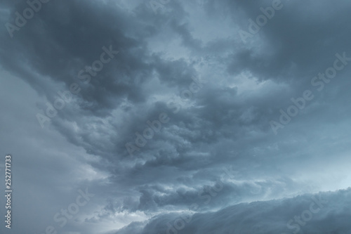 Texture of storm clouds on dark sky.