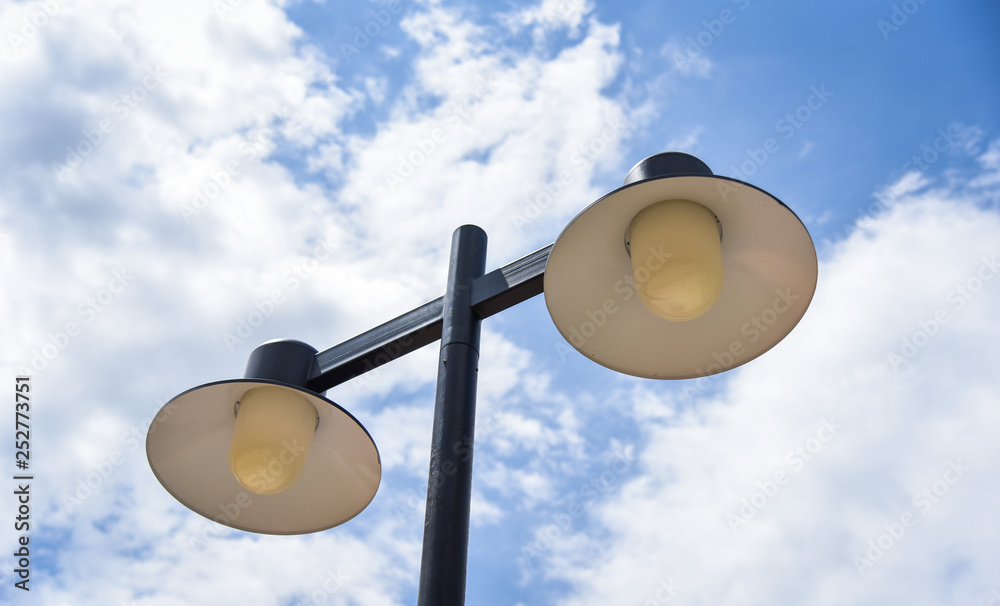 lamp post on blue sky background / Light bulb hang on the pole lamp post on blue sky background / Light bulb hang on the pole