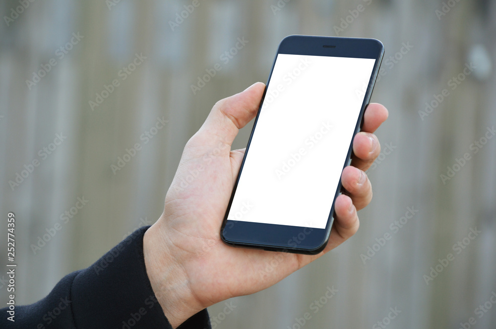 Male hand holding smart phone with clipping path