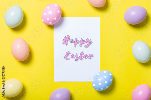 colorful easter eggs on yellow background
