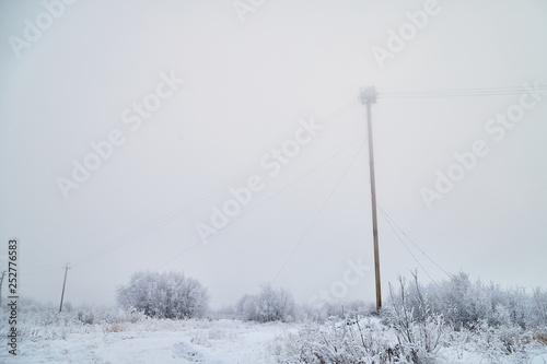 Technical tower in fog and snow in winter