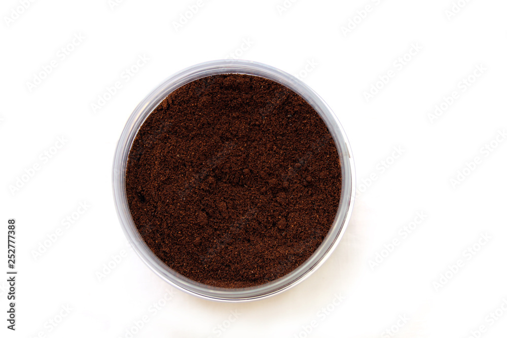 Grains of coffee in a jar, top view Grains of coffee in a jar, top view