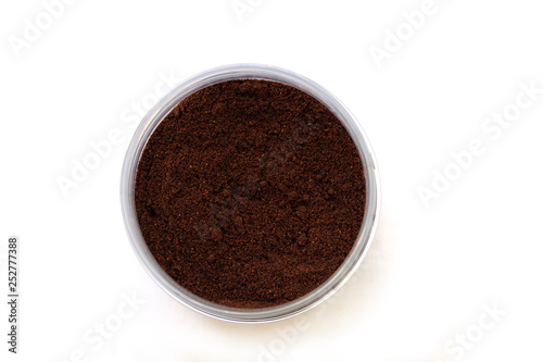 Grains of coffee in a jar, top view