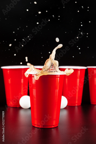 Cups for game Beer Pong on the table photo