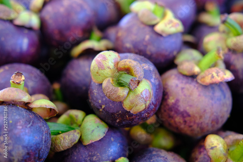 Tropical fruit mangosteen on local market photo