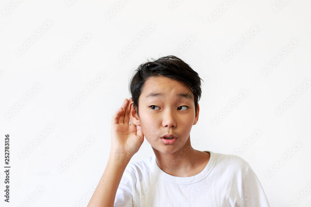 Asian boy on white background, emotion eavesdrop Asian boy on white background, emotion eavesdrop