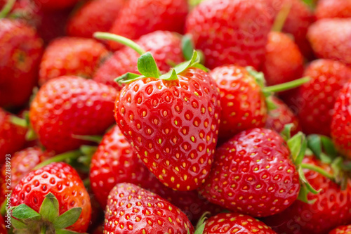 Fresh organic red ripe Strawberry fruit background closeup photo