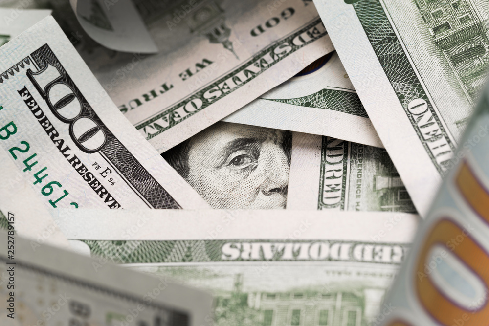 Fototapeta premium Benjamin Franklin's look on a hundred dollar bill. Benjamin Franklin portrait macro usa dollar banknote or bill.