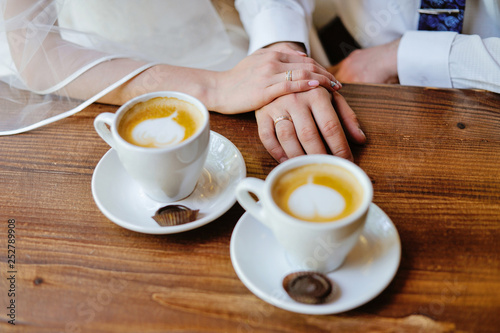 man and woman hands. love and cup coffee concept