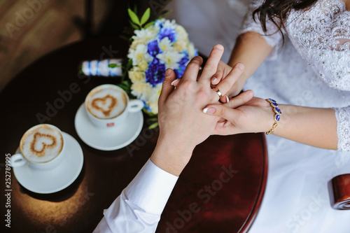 man and woman hands. love and cup coffee concept photo