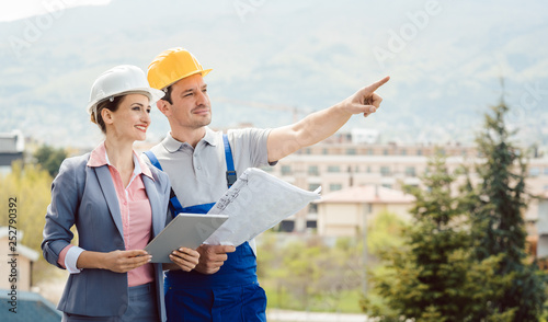 Architect and builder developing ideas for construction project