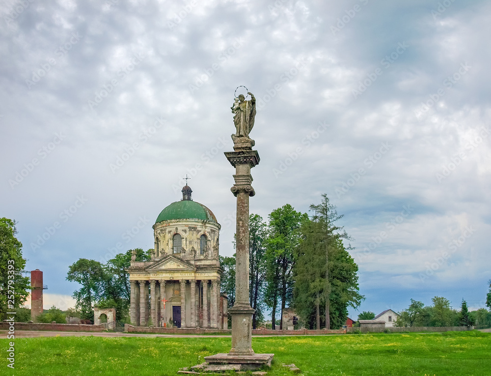Church of St. Joseph and column with sculpture. Pidhirtsi, Ukraine