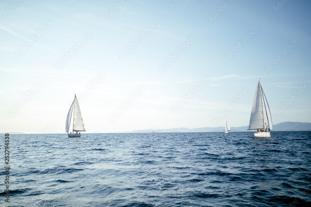 Portrait of sailing boats on open sea