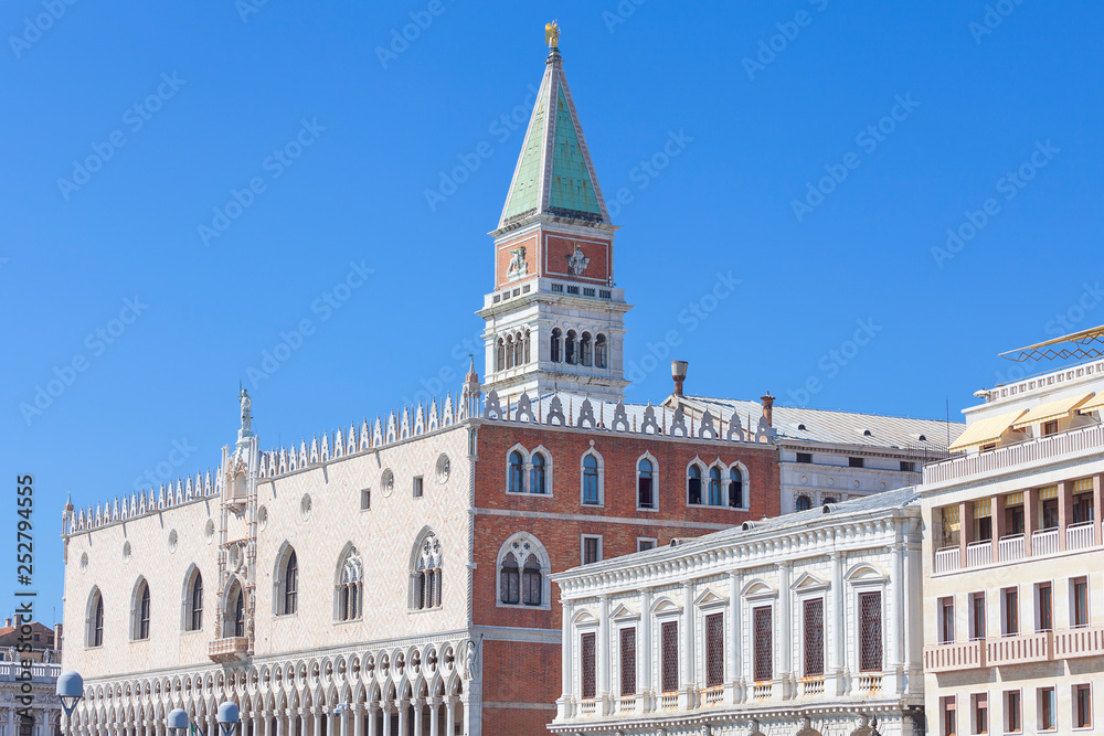 St Mark's Campanile (Campanile di San Marco) and Doge's Palace ( Palazzo Ducale) on a background of blue sky, Venice, Italy