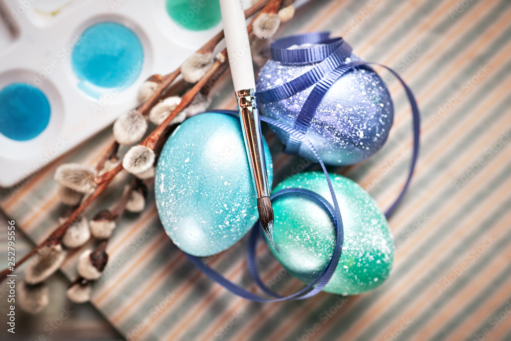 Happy Easter. Congratulatory easter background. Easter eggs and flowers. Background with copy space. Selective focus. Happy Easter. Congratulatory easter background. Easter eggs and flowers. Background with copy space. Selective focus.
