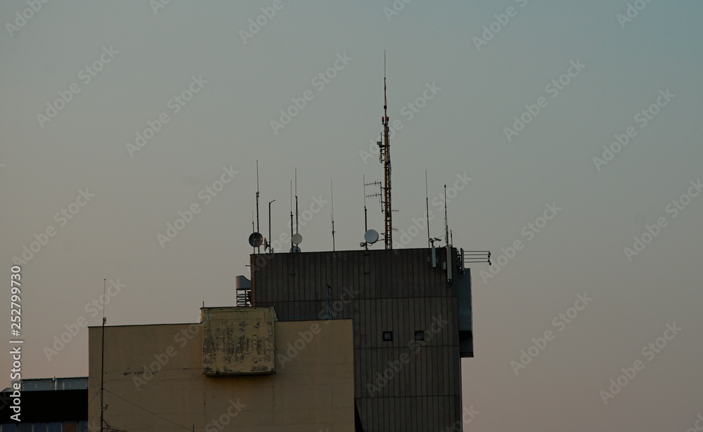 Fototapeta premium Various antennas on top of a building