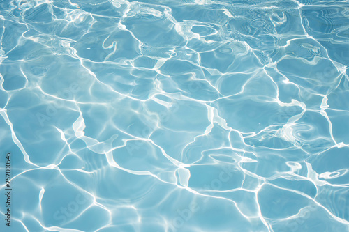 Texture of water in swimming pool for background