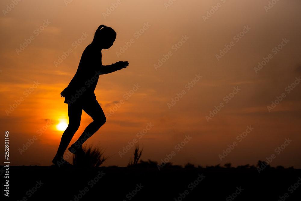 young fitness woman running on sunset seaside trail - Image