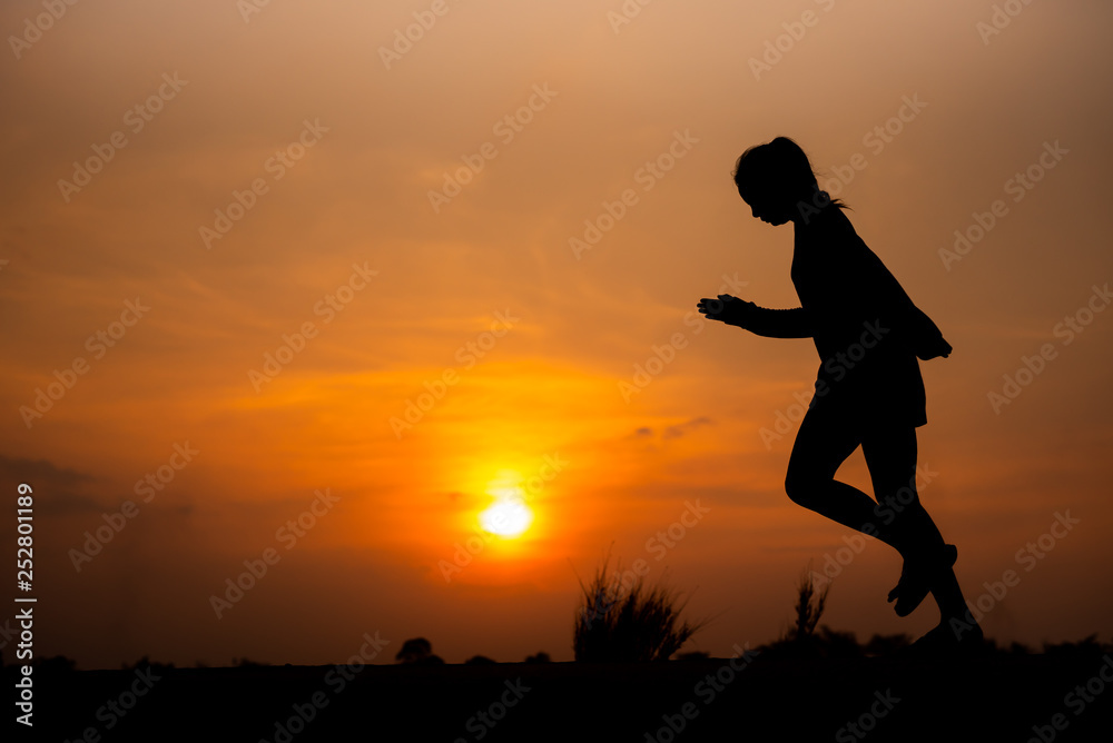 young fitness woman running on sunset seaside trail - Image young fitness woman running on sunset seaside trail - Image