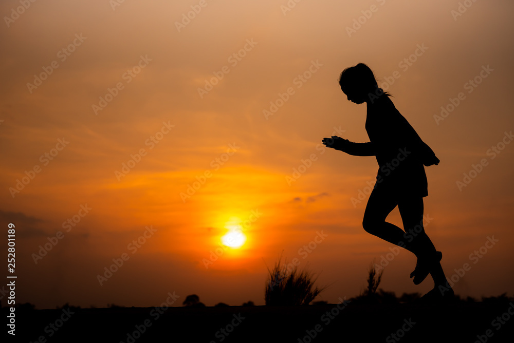 young fitness woman running on sunset seaside trail - Image