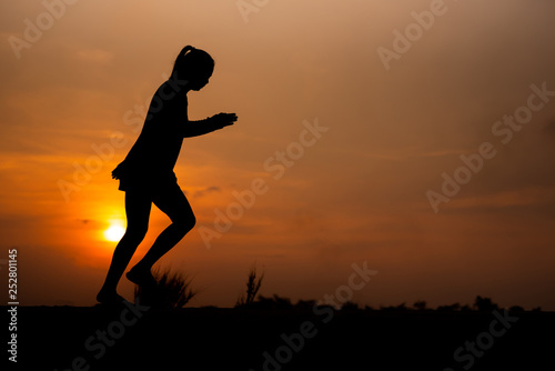 Fototapeta Naklejka Na Ścianę i Meble -  young fitness woman running on sunset seaside trail - Image