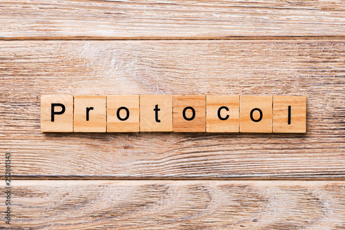 Billede på lærred PROTOCOL word written on wood block