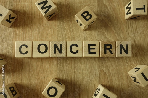 Concern word from wooden blocks on desk