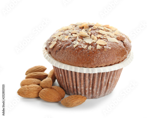Tasty almond muffin on white background