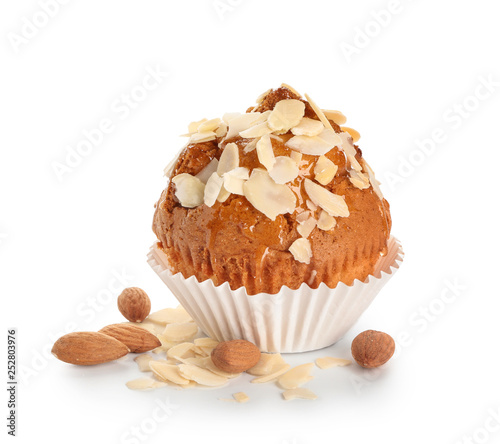 Tasty almond muffin on white background