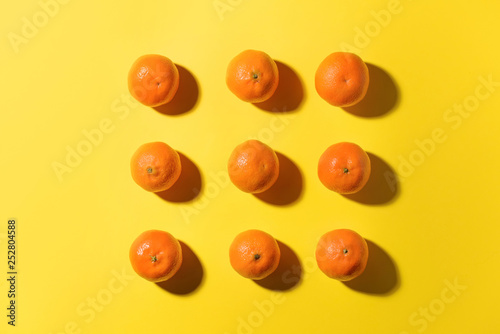 Tasty tangerines on color background © Pixel-Shot