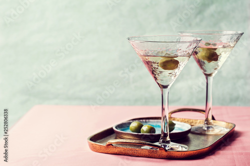 Martini cocktail with green olive photo