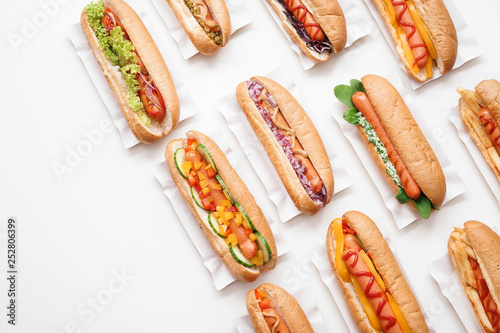 Photography Tasty hot dogs on white background