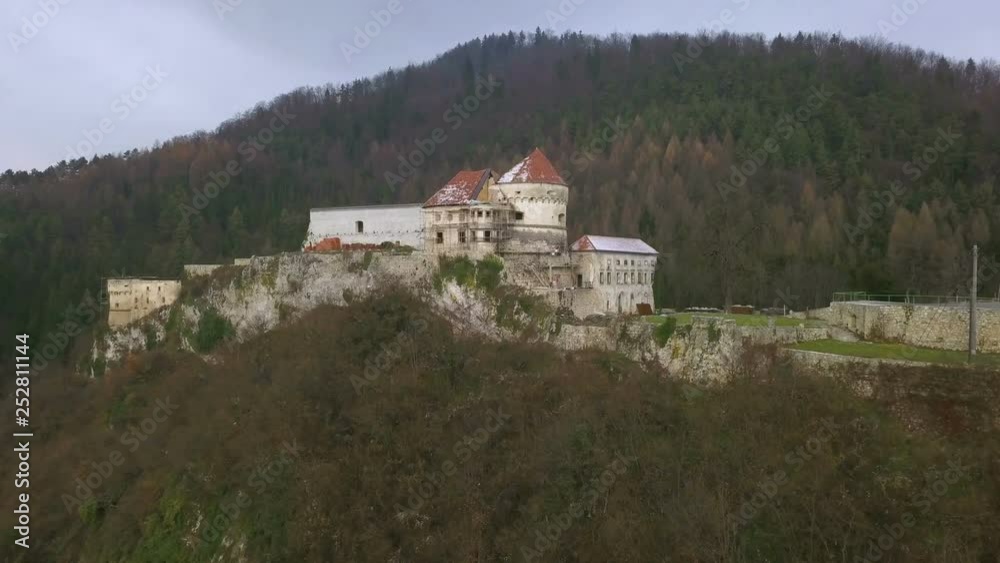 VOJNIK, SLOVENIA, 2019.01.26: Aerial: Ruins of castle Lemberg Lowenberg from air. Filming remainings of medieval castle on beautiful sunny winter morning.