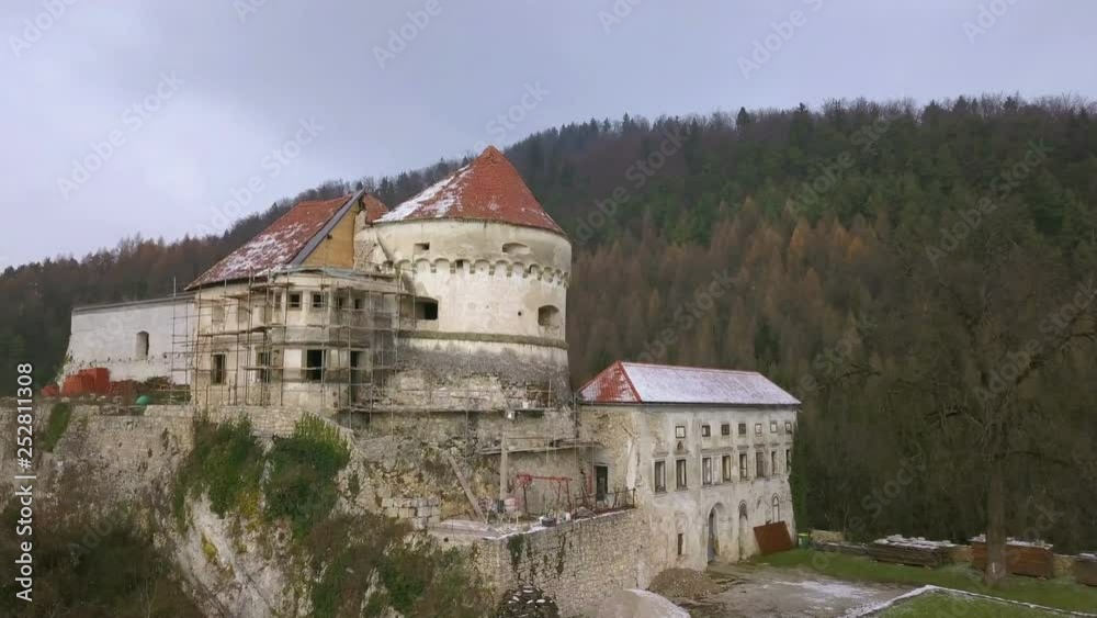 VOJNIK, SLOVENIA, 2019.01.26: Aerial: Ruins of castle Lemberg Lowenberg from air. Filming remainings of medieval castle on beautiful sunny winter morning.