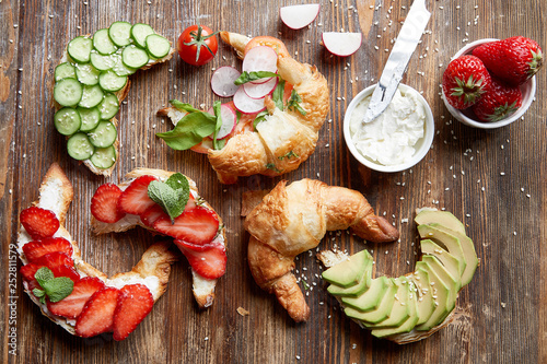 different types of croissants on wooden table