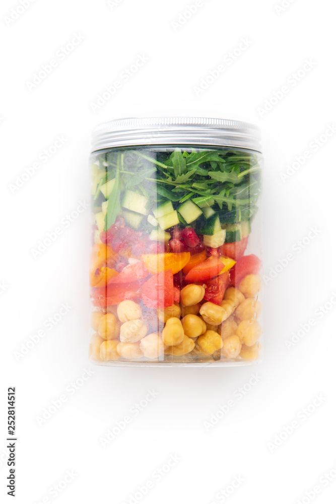 Healthy salad with chickpeas and arugula in a jar on white background. Take away easy lunch concept Healthy salad with chickpeas and arugula in a jar on white background. Take away easy lunch concept