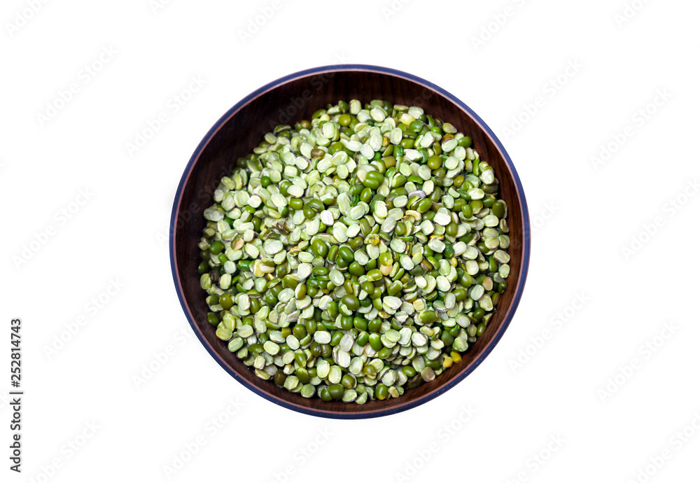Split Mung bean, green moong dal in wooden bowl. Green Mung Beans Also Know as Mung Dal, moong or green gram beans(Vigna Radiata) Pakistani/Indian Beans isolated on White Background.