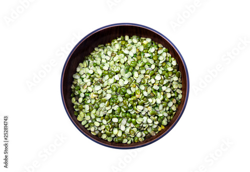 Split Mung bean, green moong dal in wooden bowl. Green Mung Beans Also Know as Mung Dal, moong or green gram beans(Vigna Radiata) Pakistani/Indian Beans isolated on White Background.