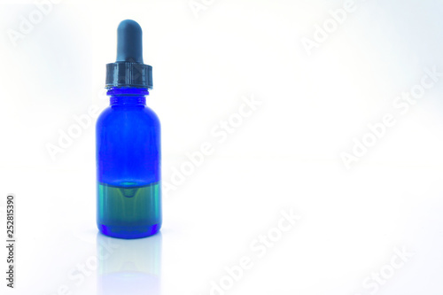 essential oil bottle isolated on white with clipping path