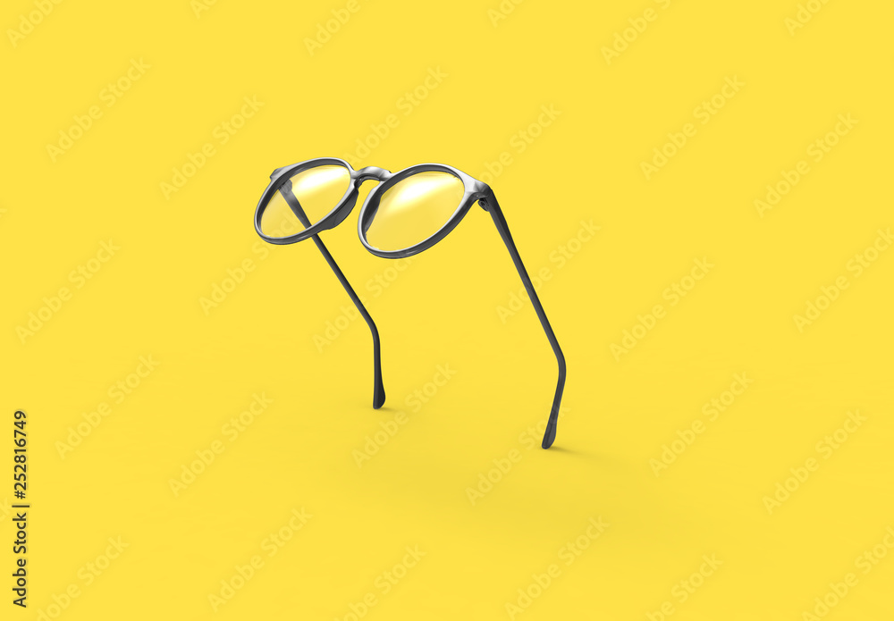Studio shot of flying Black glasses on yellow background - obrazy, fototapety, plakaty 